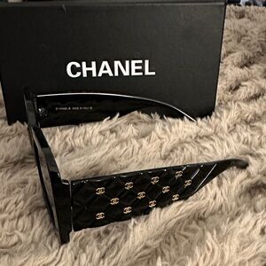 CHANEL Black Sunglasses with Gold Detailing
